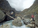 203 Log Across Miristi Khola Not much has changed since 1950. An attempt to wade the torrent gave rise to some picturesque scenes, with a cowboy Lachenal lassooing coolies as they were swept away. Eventually we solved the problem with an improvised bridge of branches (Lionel Terray, Conquistadors of the Useless).